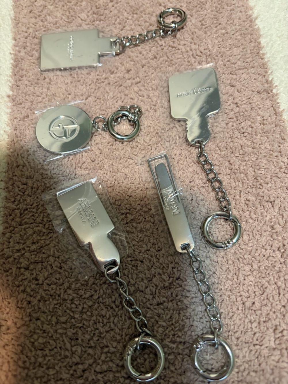 Armani 5 silver- tone purse charms